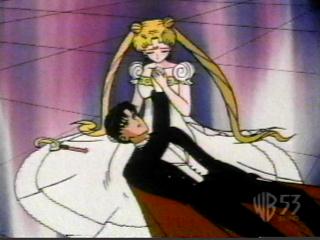 Princess Serena holding injured Prince Darien.